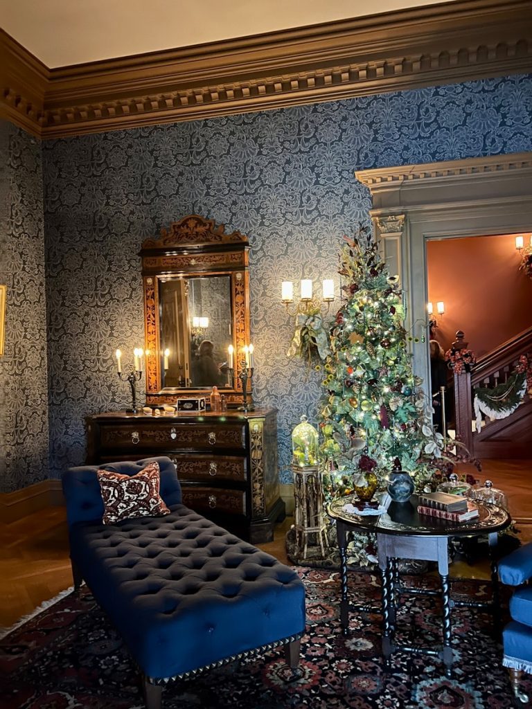 a living room with a christmas tree