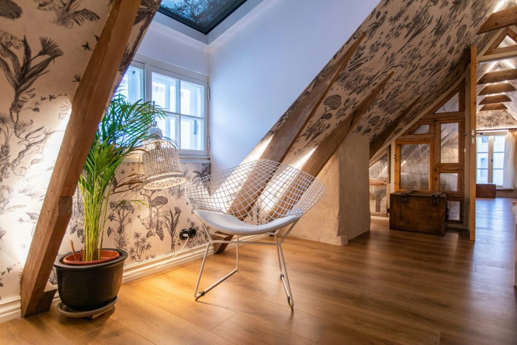 a chair and a potted plant in a room