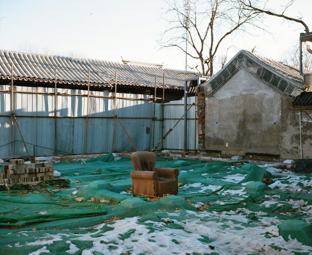 a chair sitting in the middle of a yard